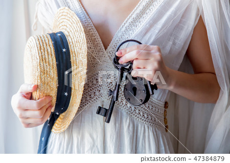 Woman holding old key in a hands 47384879