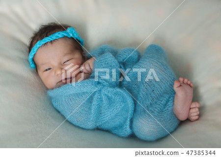 the face of a schild with a bandage on his head close-up the face of a schild with a bandage on his head close-up 47385344