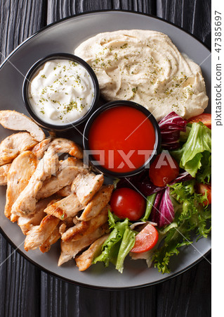 Chicken shawarma with hummus, vegetables 47385697