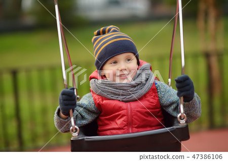 Child on swing 47386106