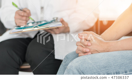 Psychiatrist consulting stressful woman patient Psychiatrist consulting stressful woman patient 47386337