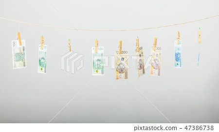 Banknotes on laundry line Banknotes on laundry line 47386738