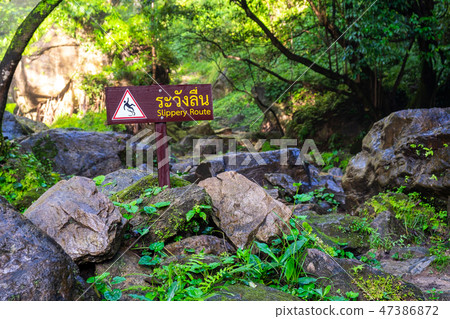 Slippery Route Warning Sign in the National Park Slippery Route Warning Sign in the National Park 47386872