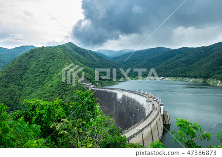 The Big Concrete Dam Between Mountains The Big Concrete Dam Between Mountains 47386873