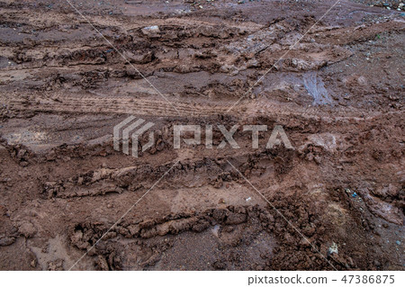 Vehicles Tire Tracks on Mud in the Forrest. Vehicles Tire Tracks on Mud in the Forrest. 47386875