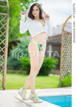 Cute woman posing standing. Cute woman posing standing. 47389870