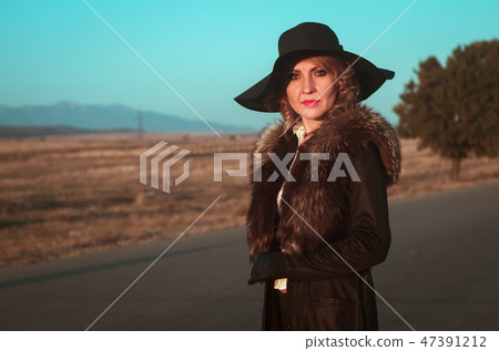 Retro beautiful blond woman portrait on road 47391212