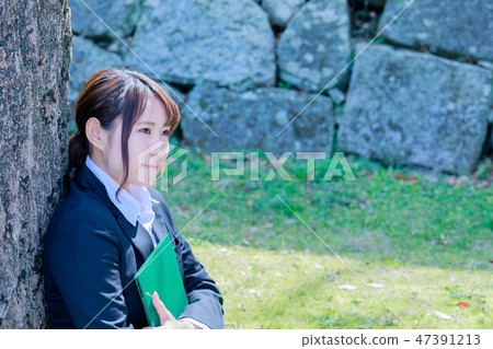 A girls student with a diploma certificate of spring departure No title 47391213