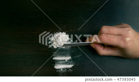 Cocaine powder on the table 47393045