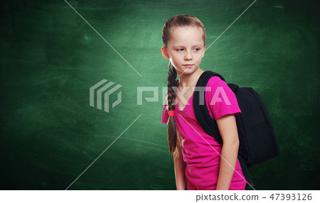 Young girl portrait with the school chalkboard 47393126
