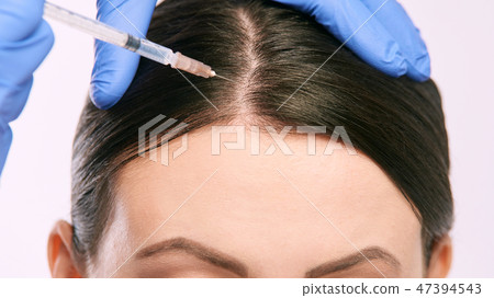 Face needle injection. Young woman cosmetology Face needle injection. Young woman cosmetology 47394543