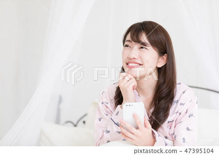 A woman on the bed 47395104