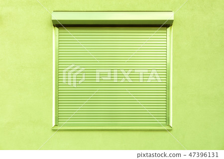 Metal blinds on the window of the facade of hous. Metal blinds on the window of the facade of hous. 47396131