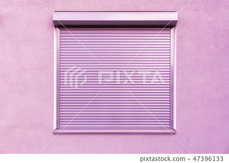 Metal blinds on the window of the facade of house. Metal blinds on the window of the facade of house. 47396133