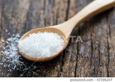monosodium glutamate, MSG on wooden spoon 47396207