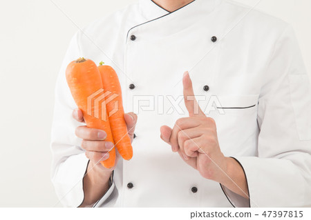 Chef with carrot 47397815