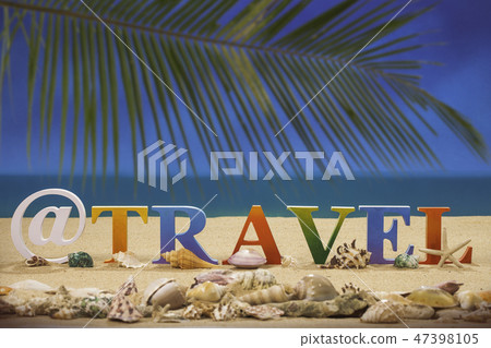 travel written in colorful letters on the beach 47398105