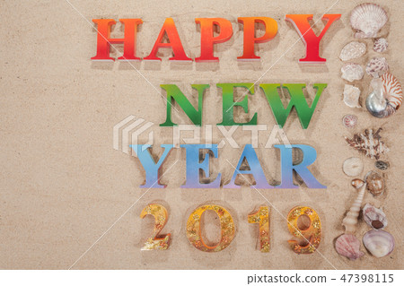 colorful letters happy new year 2019 on the beach 47398115