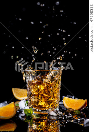 Whisky splash, orange, green mint, ice 47398558