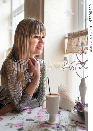 Beautiful young women in cozy cafe Beautiful young women in cozy cafe 47398709