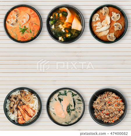 Delicious Asian dishes in black bowls. 47400082