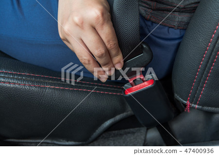 Car seat belt. woman fastens the seat belt on car Car seat belt. woman fastens the seat belt on car 47400936