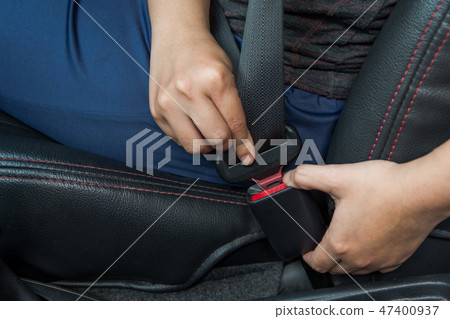 Car seat belt. woman fastens the seat belt on car Car seat belt. woman fastens the seat belt on car 47400937