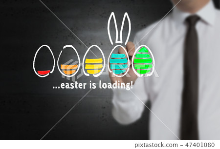 Easter is loading is written by businessman on screen Easter is loading is written by businessman on screen 47401080