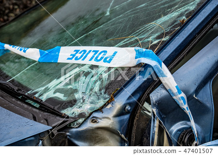 Total loss car with broken windscreen, axle fracture and police barrier band Total loss car with broken windscreen, axle fracture and police barrier band 47401507