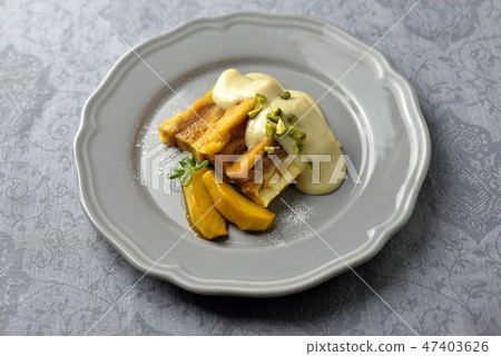 Bread pudding with custard sauce / bread and butter pudding 47403626