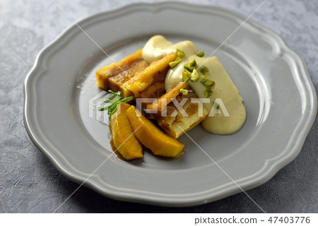Bread pudding with custard sauce / bread and butter pudding 47403776