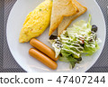 American breakfast dish with eggs, sausage, bread  47407244