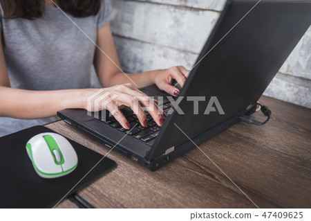 woman using laptop with casual dress 47409625