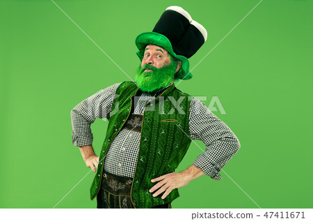 A man in a leprechaun hat at studio. He celebrates St. Patrick's Day. A man in a leprechaun hat at studio. He celebrates St. Patrick's Day. 47411671