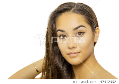 Mixed race young woman face portrait isolated on white background. 47412352