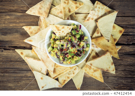 guacamole with corn chips closeup 47412454