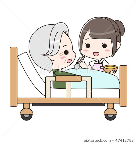 A female caregiver assisting a senior male meal A female caregiver assisting a senior male meal 47412792