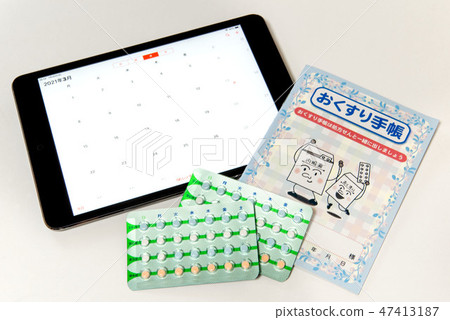 Calendar, medicine notebook and pill 47413187