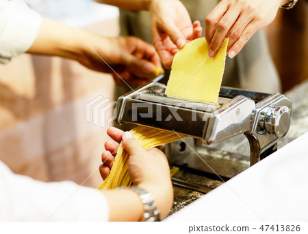 Chef making pasta with a machine, home made pasta 47413826