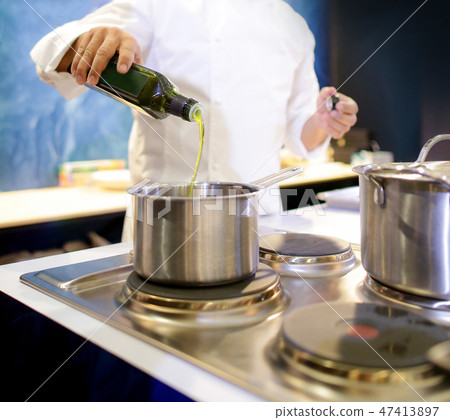 Chef cooking food in the kitchen, preparing food 47413897