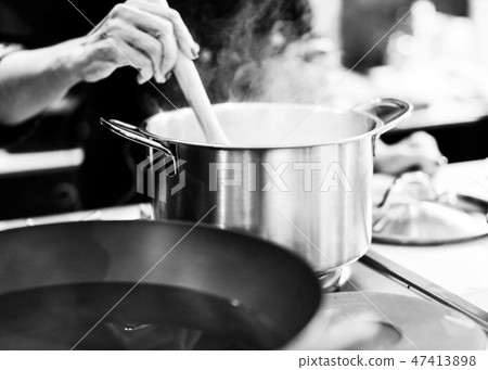 Chef cooking food in the kitchen, preparing food 47413898