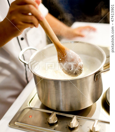 Chef cooking food in the kitchen, preparing food Chef cooking food in the kitchen, preparing food 47413901