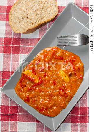 Domestic vegetable stew served on the plate with bread Domestic vegetable stew served on the plate with bread 47414041