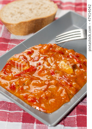 Domestic vegetable stew served on the plate with bread Domestic vegetable stew served on the plate with bread 47414042