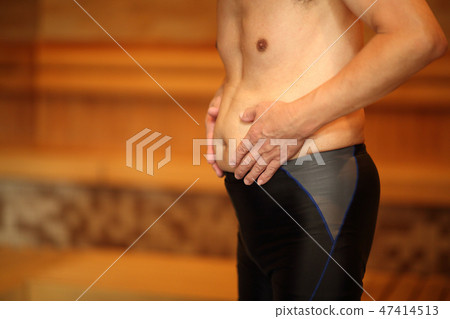 Men relaxing in the sauna Men relaxing in the sauna 47414513