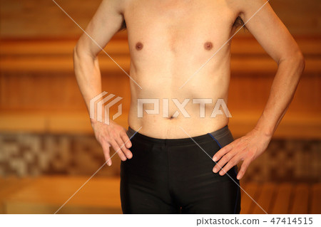 Men relaxing in the sauna 47414515