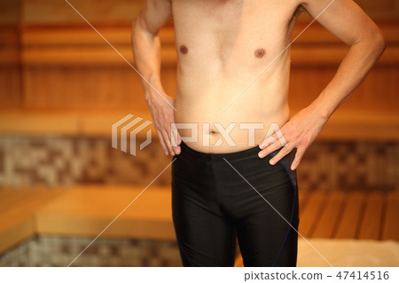 Men relaxing in the sauna 47414516