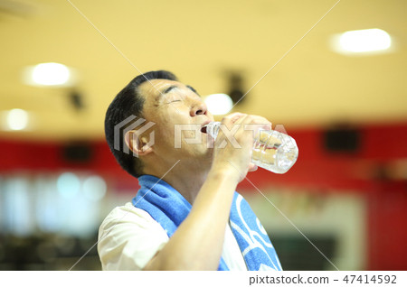 Men in their 60s attending a sports gym Men in their 60s attending a sports gym 47414592