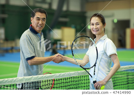 60s and 60s playing tennis 47414990