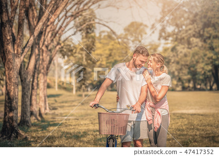 Portrait of Young couple enjoying in the park Portrait of Young couple enjoying in the park 47417352
